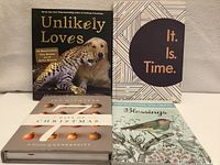 All four books front covers visible