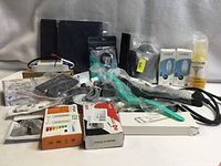 Full lot overview showing all boxed and bagged items