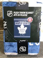 Front of packaged Toronto Maple Leafs plush throw blanket