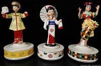Front view of all three Schmid Brothers ceramic music box figurines