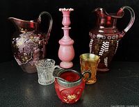 Group shot of all six antique glass items