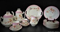 Complete coffee ensemble arranged; shows all pieces and decoration