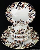 Full group shot of two platters, covered bowl, open bowl and lid
