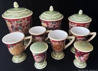Full set of three lidded canisters, four mugs, two shakers