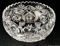 Three-footed cut glass fruit bowl close-up