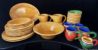Group view of all Bordallo Pinheiro Amber Grape and Pacific Rim Santa Fe pieces