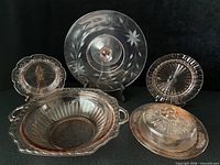 Group shot of five pink depression glass pieces