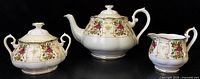 Full view of teapot, covered sugar bowl, and creamer