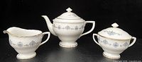 Teapot, creamer, covered sugar bowl full view