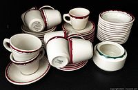 Group shot of cups, saucers, plates, sugar bowl