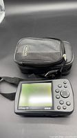 Front view of Garmin GPSmap 176 with screen, keypad, and carry case visible