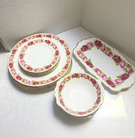 Stack of plates, bowls and tray showing pattern and piece sizes
