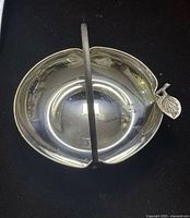 Top view of apple-shape sterling bowl with handle