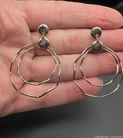 Front view showing both earrings, double hoop design and stud tops