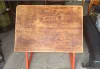 Top view of wooden drafting table surface