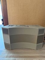 Front view of Bose AW-1 Acoustic Wave showing curved speaker grille