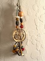 Full view of necklace showing pendant, dangles and upper bead stack