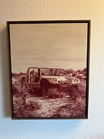 Framed sepia photograph of Lamborghini Cheetah prototype displayed on wall
