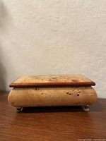 Side view showing burl grain and metal feet