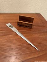 Letter opener and walnut card holder on desk