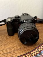 Front view of Panasonic Lumix DMC-FZ50 with lens cap attached