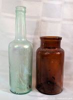Front view of both bottles standing side by side