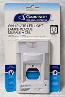 Front view of sealed Garrison wallplate LED light package