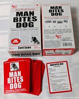 Open box showing stacks of red-back cards and box lid