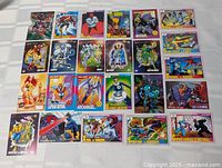 Top view of all 24 Marvel trading cards laid out in four rows of six