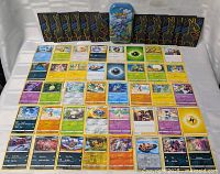 Full layout of cards, sleeves, and tin