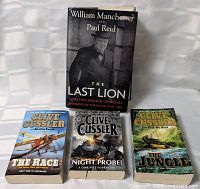 Front view of all four books standing and lying flat