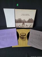 Open box with three inner sleeves and two visible LPs
