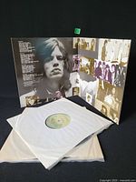 Gatefold jacket opened with both vinyl records in inner sleeves