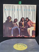 Front album cover showing title and band photo