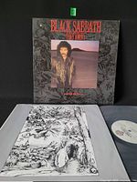 Front jacket showing album art and punch hole