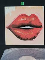 Front jacket showing lip artwork and title