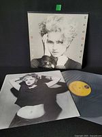 Front cover showing Madonna portrait with lot components