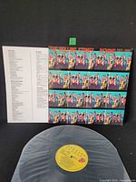 Front sleeve, lyric insert, partial view of vinyl