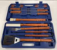 open case showing full barbecue tool set