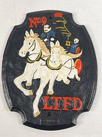 Full view of cast iron plaque showing complete design and mounting shape