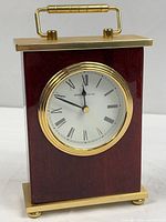Full view of Howard Miller wood and brass desk clock