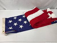 Folded Valley Forge cotton U.S. flag showing stars and header