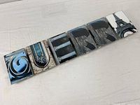 Entire photo display bar showing six frames spelling word