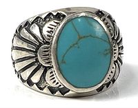 Front view showing turquoise cabochon and engraved shoulders