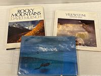 Front view of the three books laid out