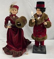 Full view of both 28" animated lighted Victorian dolls standing side by side