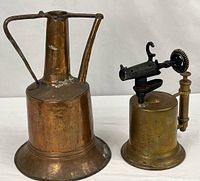 Pitcher and blowtorch side by side full view