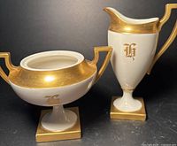 Creamer and sugar bowl showing overall design, gold gilt, monograms