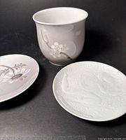 Cup and two small dishes showing designs