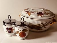 Covered vegetable bowl and two egg coddlers grouped together